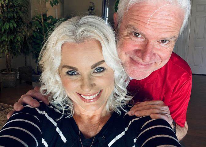Hank and Shelly Cowles smile together at home.