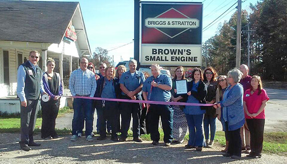 group photo of grand opening of Brown's Small Engine